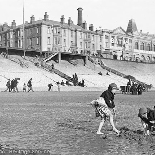 Children digging on the beach