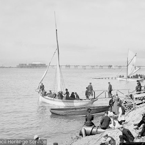 People boating with Blackpool Central Pier in the background