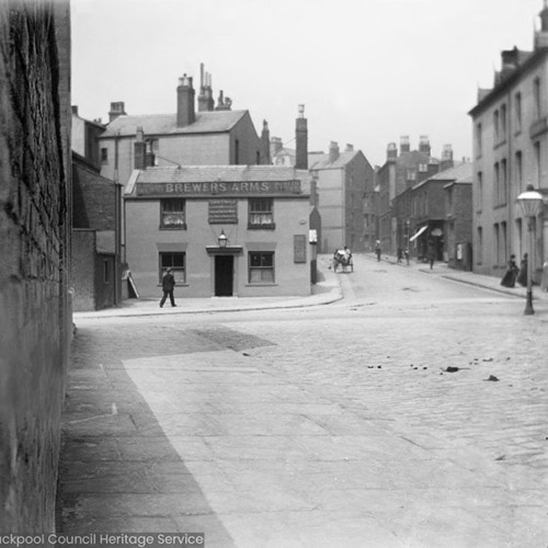Street scene with 'Brewers Arms' pub in background