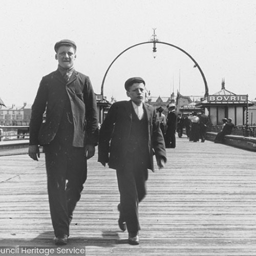 Two men walking on Blackpool Central Pier