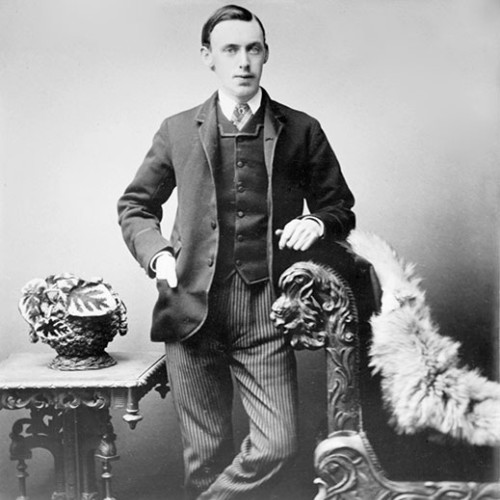 Portrait of a young man leaning on a couch