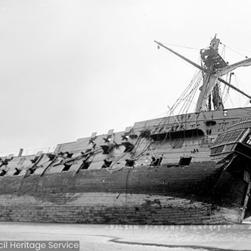 Sailing ship wrecked on beach