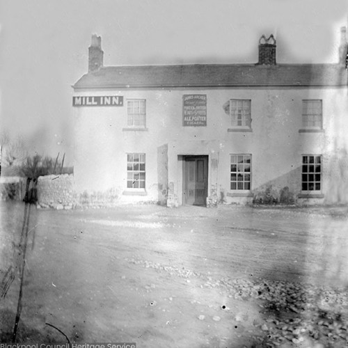 Inn building viewed across the street, sign reads 'James Archer: Foreign and British Wines and Spirits, Ale, Porter, Cigars.'