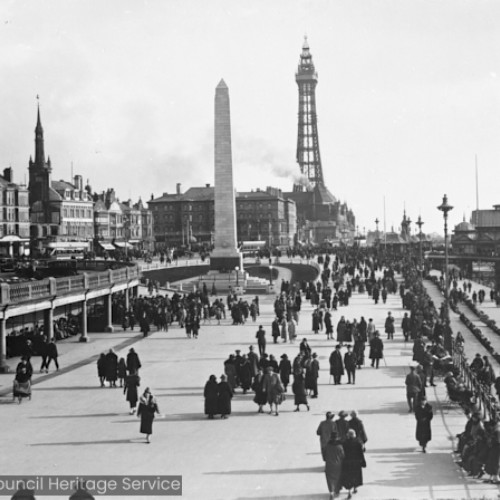 Crowds walking on Blackpool seafront