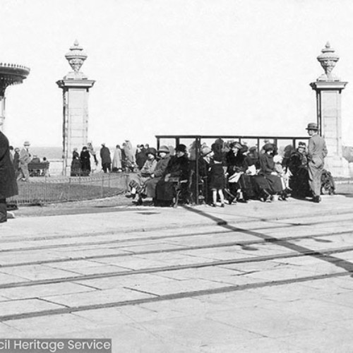 Crowds sat at a seafront shelter on the seafront