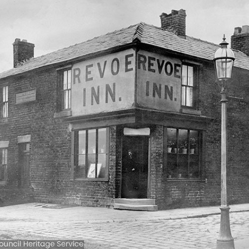 A pub building with large sign reading 'Revoe Inn.'