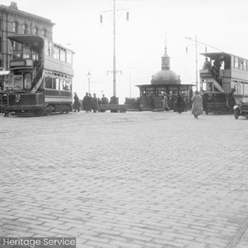 Trams and crowds in street