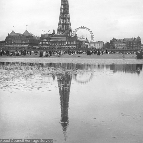 Reflection of Blackpool Tower in a pool on the beach