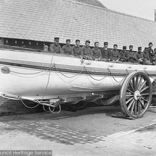 Crew sat in Lifeboat on carriage