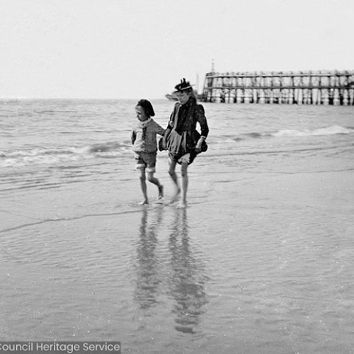 Two children playing on the beach