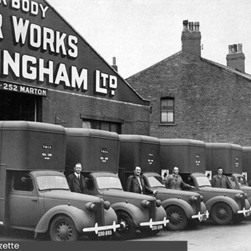 Six vehicles lined up with their drivers stood next to them outside the Burlingham garage.