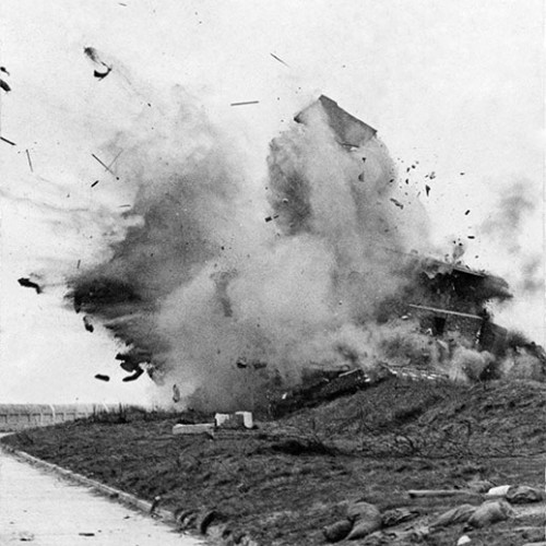 Observation post destruction, with debris and smoke from the explosion.