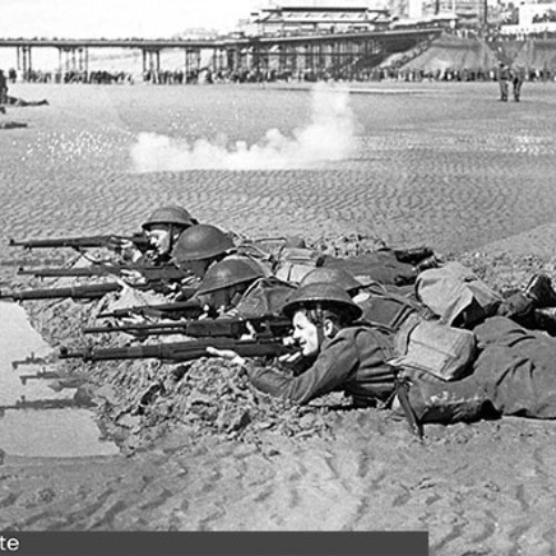 Groups of Home Guard on the beach doing rifle practice.