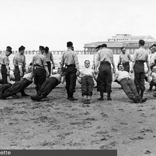 RAF training on the beach in a circle.