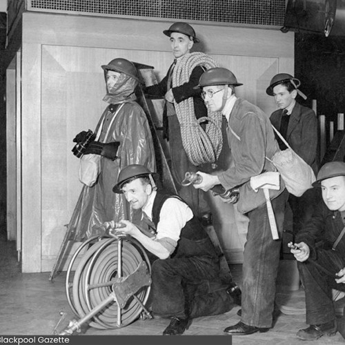 Group of six men doing a fire drill.