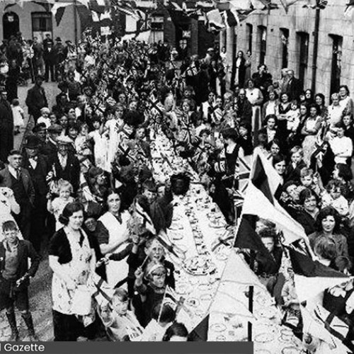 Group of people having a street party.