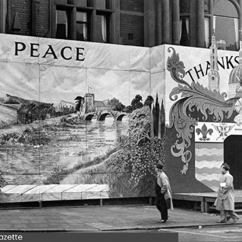 Entrance to the Town Hall, which has been covered by painted boards. Around the doorway is the Blackpool coat of arms and the words Thanksgiving and Peace.