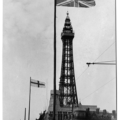 Flags flying on the Promenade and Blackpool Tower.