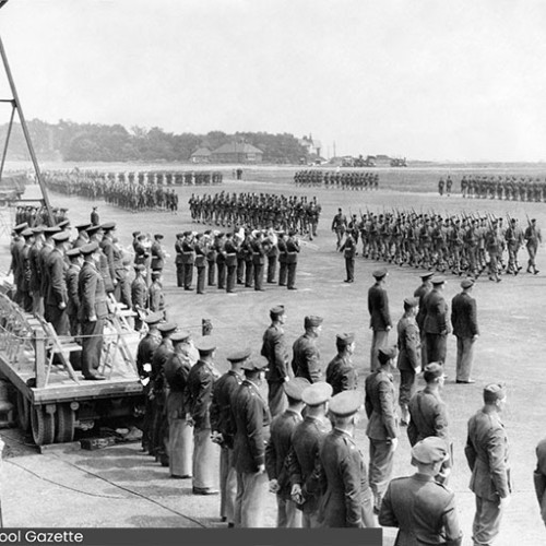 Military parade on an airfield.