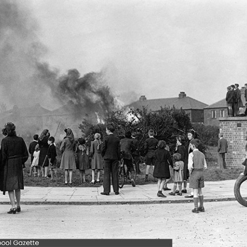 People gathered around a bonfire.