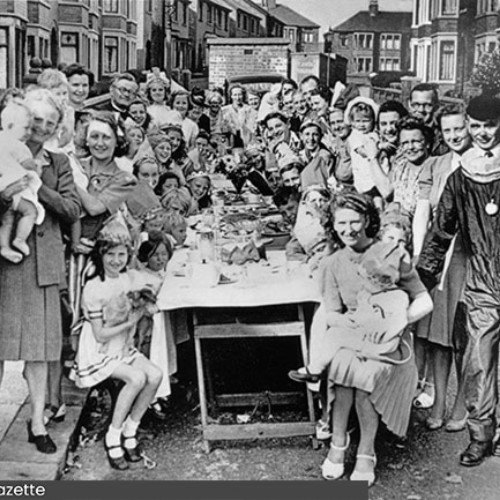 Group of people having a street party.