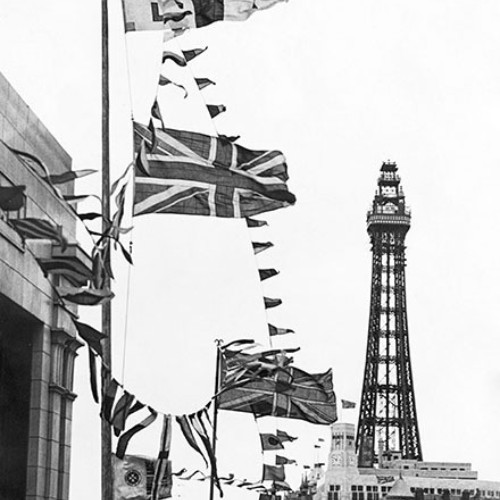 Flags flying and the Blackpool Tower in the background.