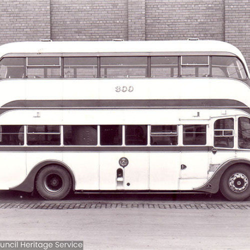 Side view of a double decker bus with number 300 on the side.