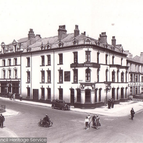 Street scene of a large hotel building.