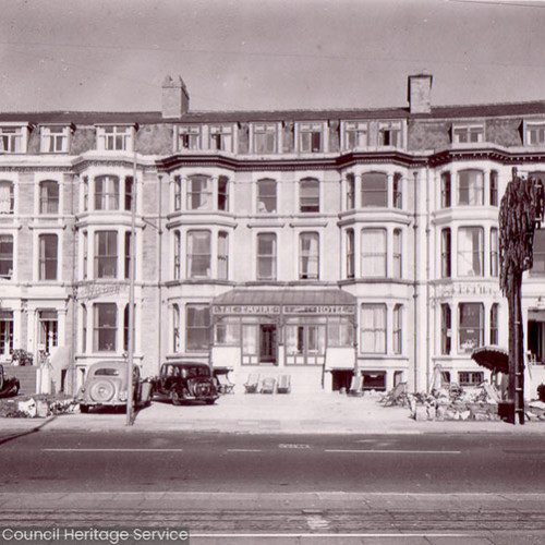 Street view of a large hotel building.