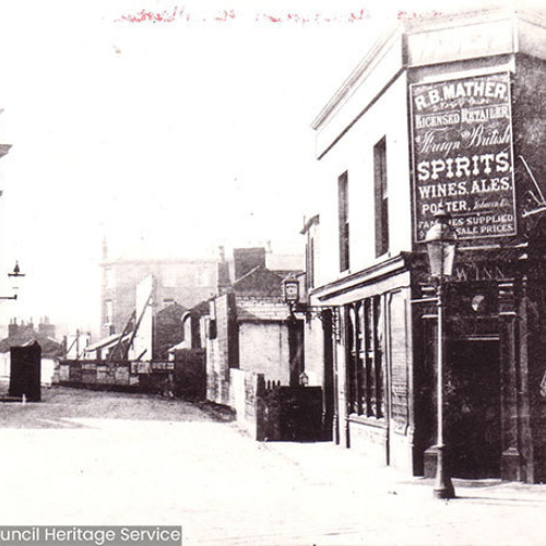 Street scene with the frontage of an inn.