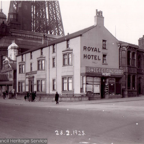 Street scene with hotel building and Blackpool Tower in the background.