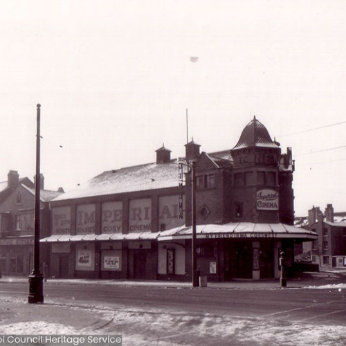 Street scene with cinema building.