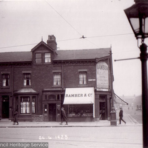 Street scene with houses and shop.