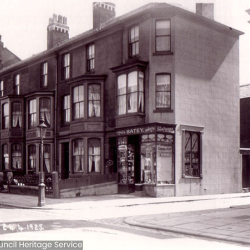 Street scene with houses and shop.