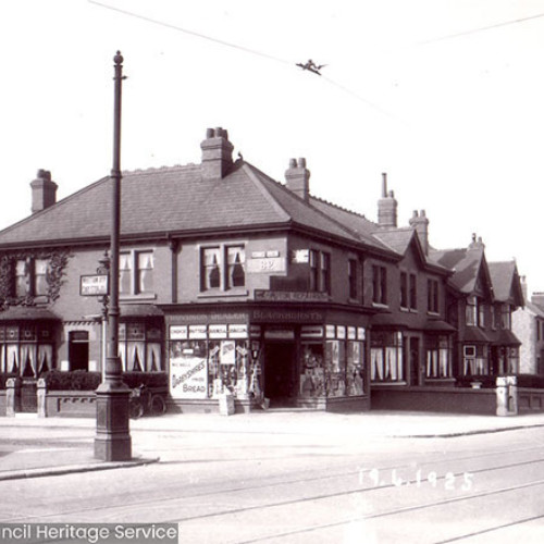 Street scene with corner shop.