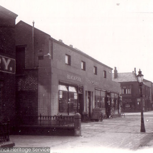 Street scene with parade of shops.