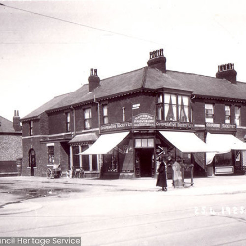 Street scene with houses and shops.