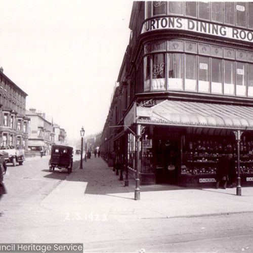 Street scene with frontage of restaurant with a veranda.