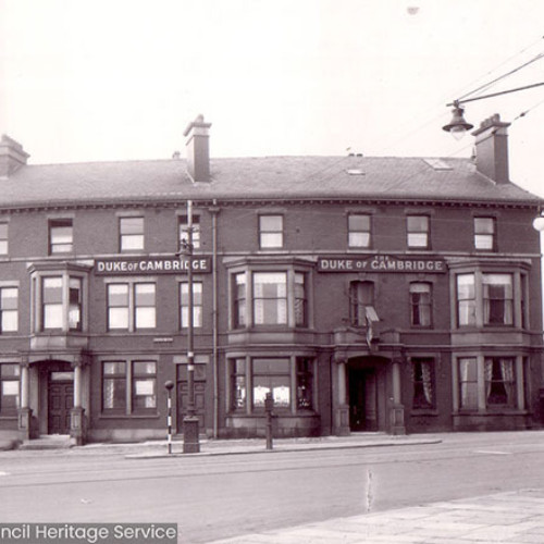 Street view of a public house frontage.