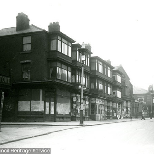 Street scene with parade of shops.