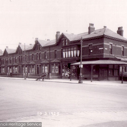 Street scene with houses and shop.