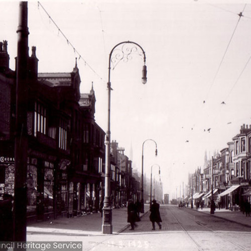 Street scene with parades of shops.