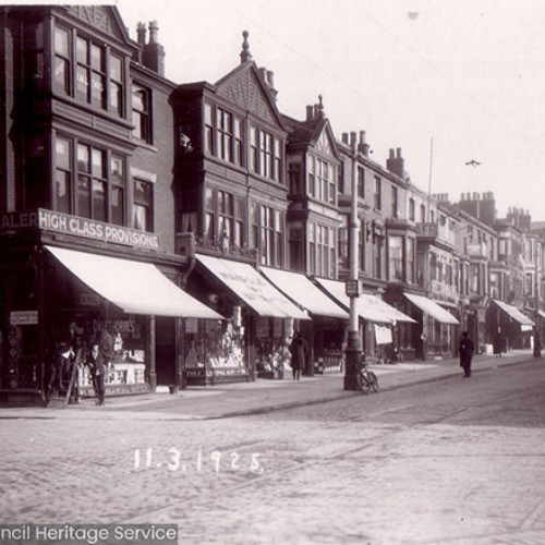 Street scene with parade of shops.