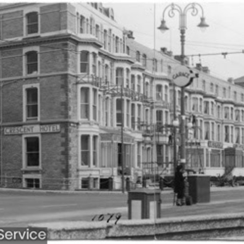 Street corner and a block of hotels including the Crescent Hotel and Anderson's Claremont.