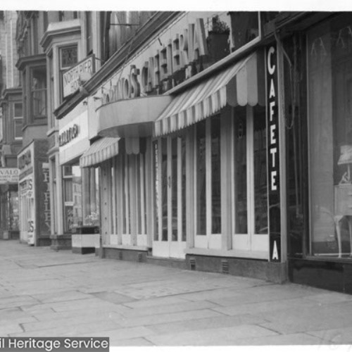 Shop fronts, including a Cafeteria.