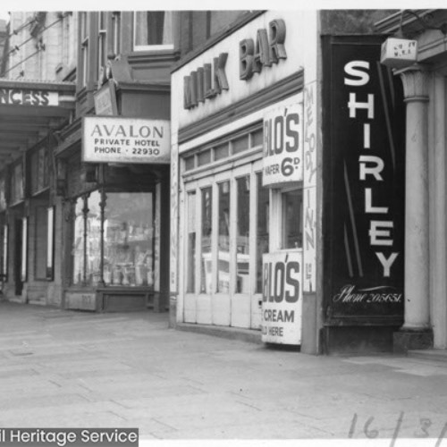 Shop fronts, including the Milk Bar, Avalon Private Hotel and the Princess Cinema.