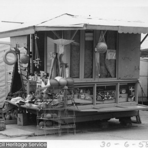 Gifts stall, with items hanging from the outside of the stall.