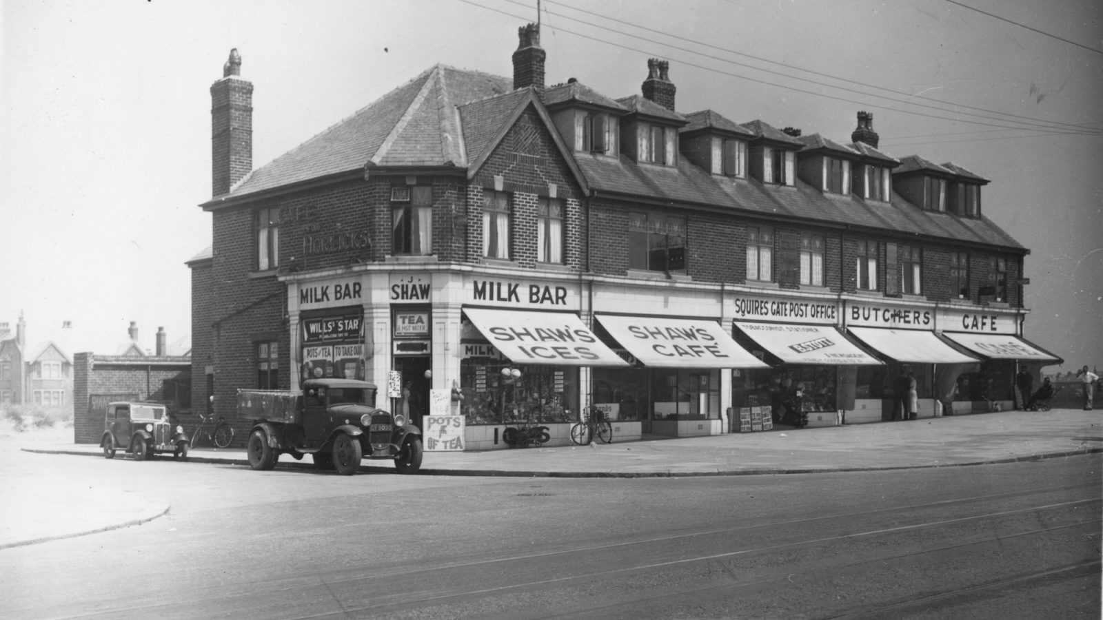 Row of shops, from left to right is the Milk Bar, Shaw's Ices, Shaw's Cafe, Squires Gate Post Office, Butchers and Cafe.