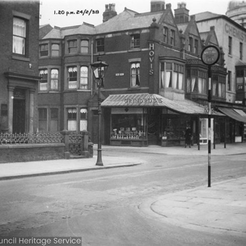 Shop fronts and the corner of the Winter Gardens Olympia.