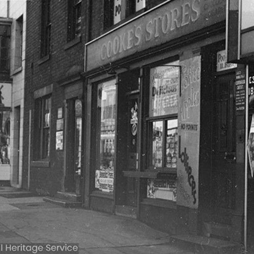 Shop fronts, with Cooke's Stores in the centre.